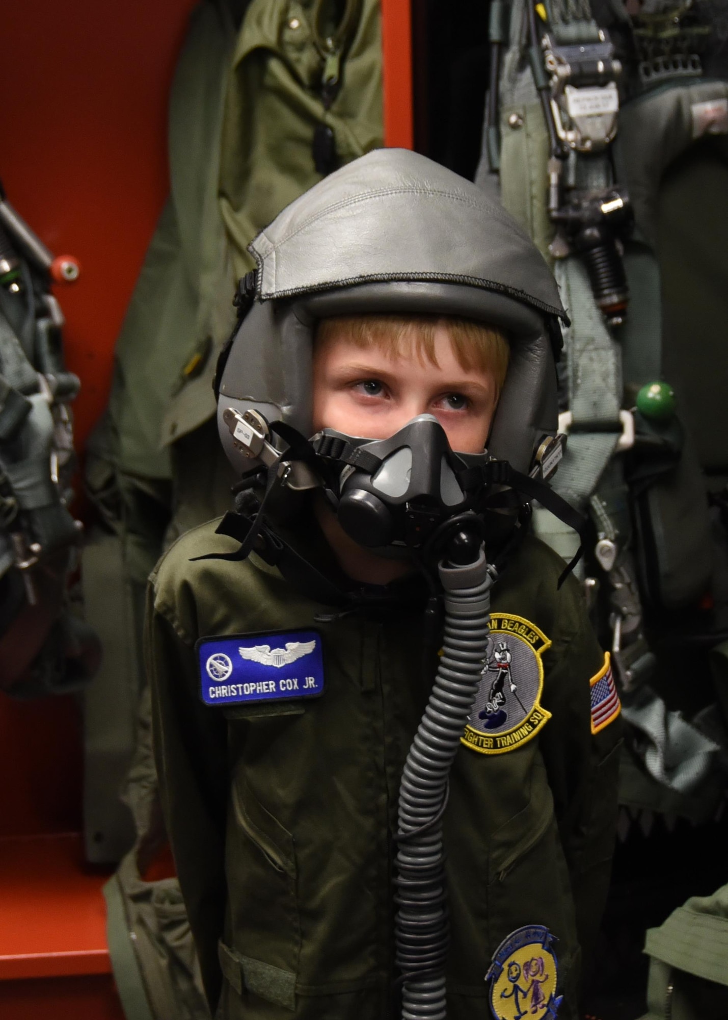 Honorary pilot Christopher Cox dawns flight equipment from the 2nd Fighter Training Squadron at Tyndall Air Force Base, Fla., April 21, 2017. Cox had the opportunity to tour base facilities, watch air show rehearsal performances, and have a meet and greet with the U.S. Air Force Air Demonstration Squadron Thunderbirds. (U.S. Air Force photo by Airman 1st Class Isaiah J. Soliz/Released)