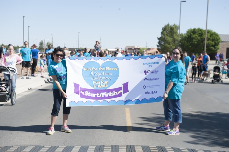The Youth and Teen Center hosted Run for the Pieces, a fun run and walk that aimed to raise awareness for children that are on the autism spectrum on April 22, 2017 at Holloman Air Force Base, N.M. Hundreds of adults and children participated in the run to support Autism Awareness. (U.S. Air Force by Airman 1st Class Ilyana A. Escalona)