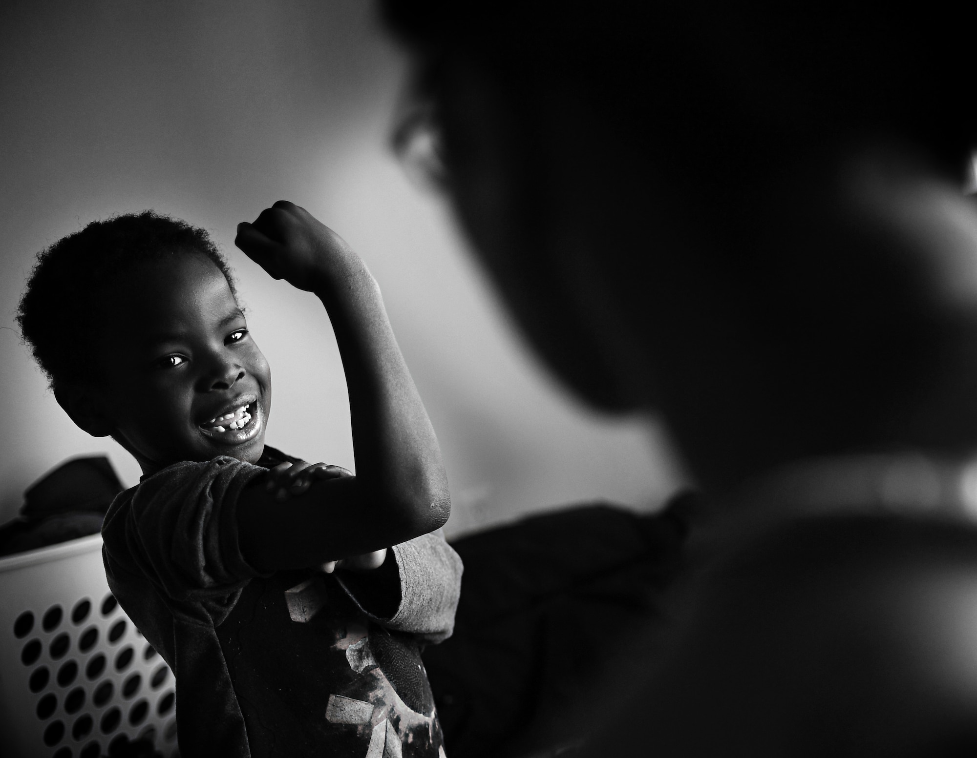 Jamel, 6, shows off his muscles to his mother Semaj, 432nd Aircraft Maintenance Squadron supply craftsman, April 2, 2017, at their home in Las Vegas. Semaj is a nationally qualified amateur bodybuilder in the figure category while also being a U.S. Air Force staff sergeant, part-time student and single mother. (U.S. Air Force photo/Senior Airman Christian Clausen)