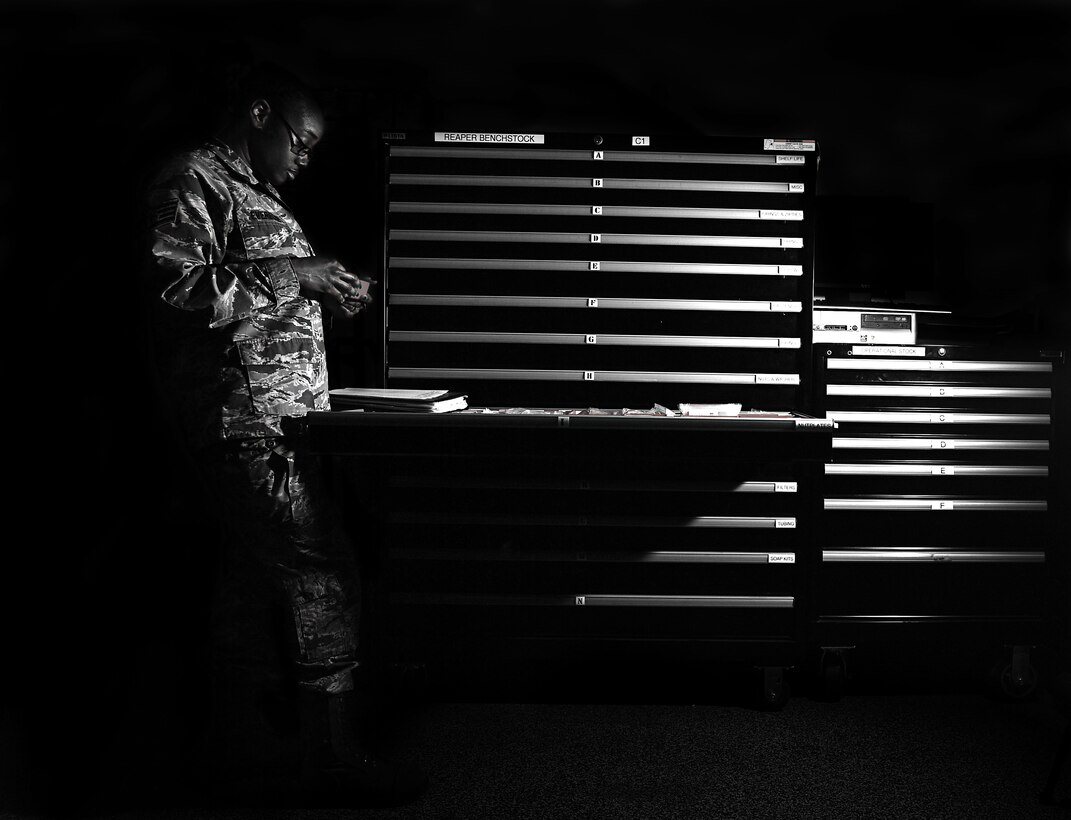 Staff Sgt. Semaj, 432nd Aircraft Maintenance Squadron supply craftsman, completes a drawer check March 27, 2017, at Creech Air Force Base, Nev. Semaj is responsible for ordering and ensuring parts availability for MQ-1 Predators and MQ-9 Reapers. (U.S. Air Force photo/Senior Airman Christian Clausen)