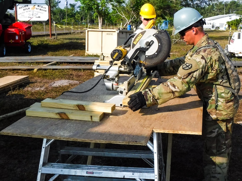 Sgt. Luke Konzal, of the 672nd Engineer Company, 301st Maneuver Enhancement Brigade, cuts a 2x4 beam which will be used to create bracing at the Double Head Cabbage clinic in Double Head Cabbage, Belize, April 1, 2017. The soldiers were deployed to Belize in support of Beyond the Horizon, U.S. Army South and U.S. Southern Command’s annual multinational humanitarian and civic assistance program (Courtesy Photo).
