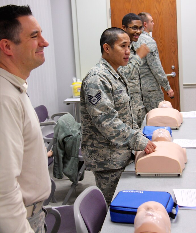 Airmen of the 932nd Airlift Wing helped each other train with mannequin patients during the Unit Training Assembly at Scott Air Force Base, Ill. Basic life saving skills were taught methodically, step by step, with instructors watching during Emergency Medical Technician (EMT) training, inside the 932nd Medical Group building. This included proper procedures for patient assessment and trauma treatment in a special class held at Scott Air Force Base, Ill. The 932nd Medical Group is an Illinois unit, one of four groups under the 932nd Airlift Wing, a 22nd Air Force unit and part of the Air Force Reserve Command.  (U.S. Air Force photo by Lt. Col. Stan Paregien)