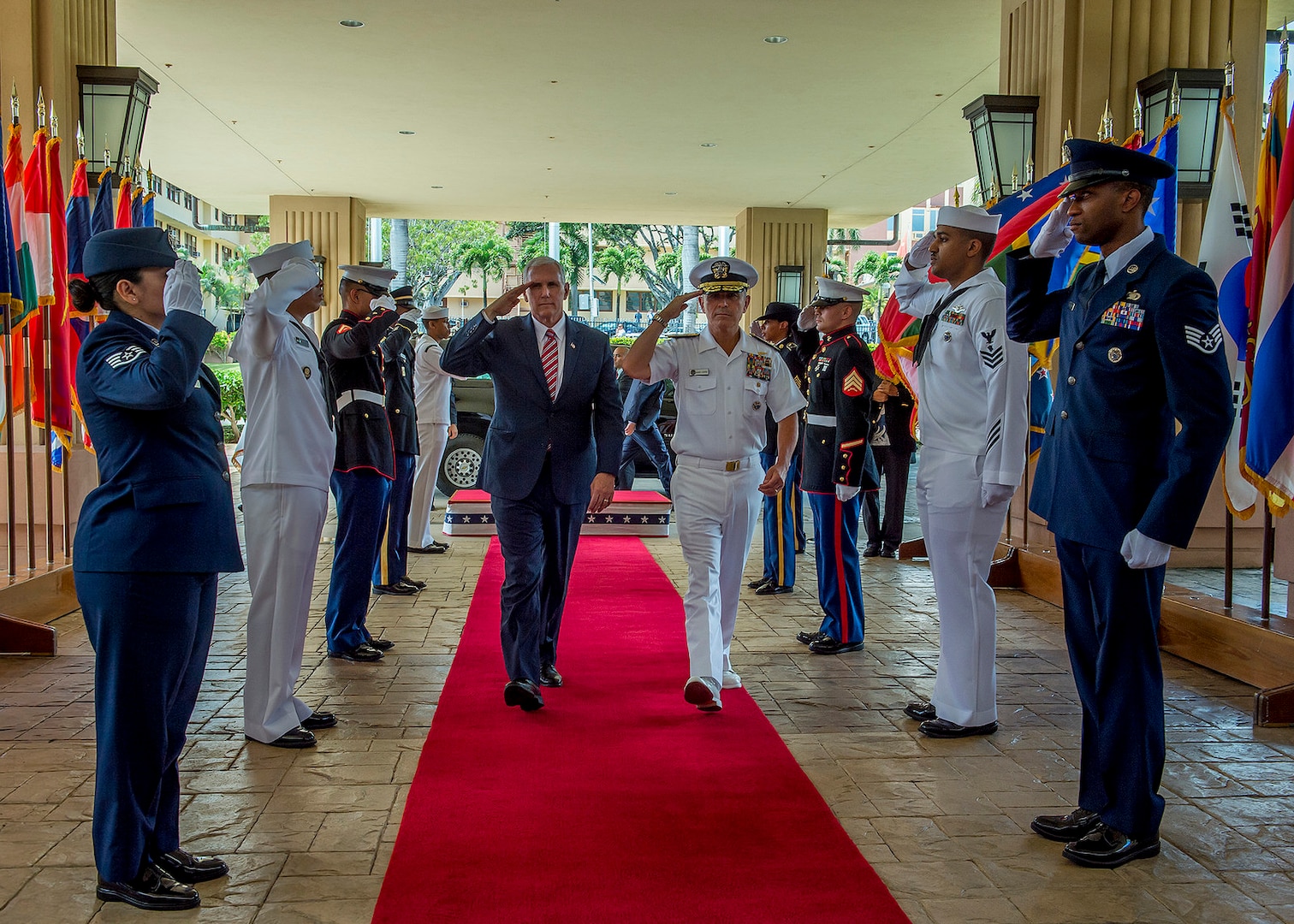 Vice President Mike Pence and Adm. Harry B. Harris Jr., Commander, United States Pacific Command (USPACOM), salute the sideboys as they are piped aboard at USPACOM headquarters, April 24, 2017.  Pence’s stop in Hawaii caps off his first official visit to the Indo-Asia-Pacific region reinforcing the United States' full commitment to its security alliances and partnerships.