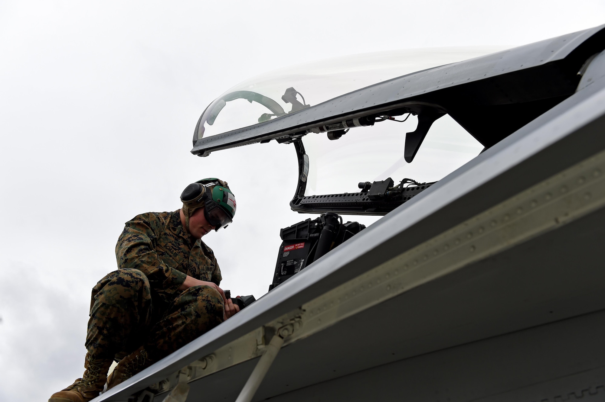 U.S. Marine Corps Sgt. Dominic Schulte, Marine Fighter Attack Squadron 232 flight equipment technician from Miramar, Calif., works on an FA-18C Hornet from his squadron at the flight line at Joint Base Elmendorf-Richardson, Alaska, for Exercise Northern Edge, April 24, 2017. Various military aircraft from all services will practice operations, techniques and procedures while enhancing interoperability during Northern Edge 2017 – Alaska’s premier joint-training exercise. 