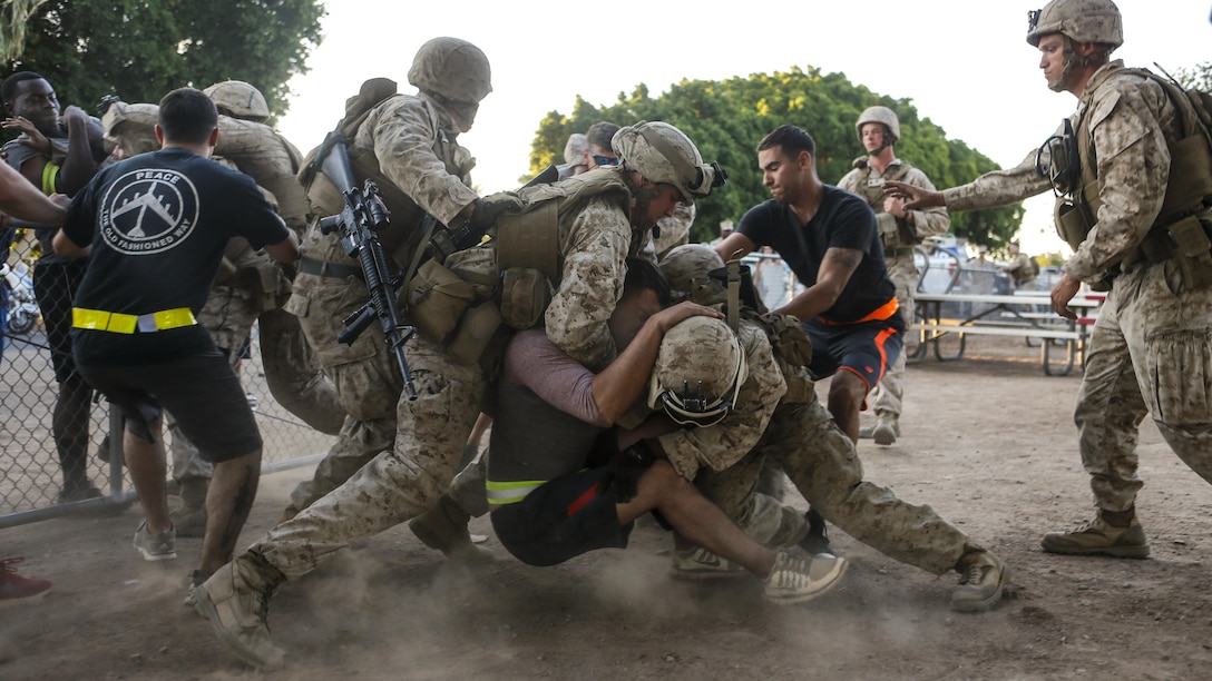 Marines detain a role player during an assault support tactics exercise at Kiwanis Park in Yuma, Ariz., April 21, 2017. The Marines are assigned to the 2nd Battalion, 6th Marine Regiment. Marine Corps photo by Lance Cpl. Andrew M. Huff
