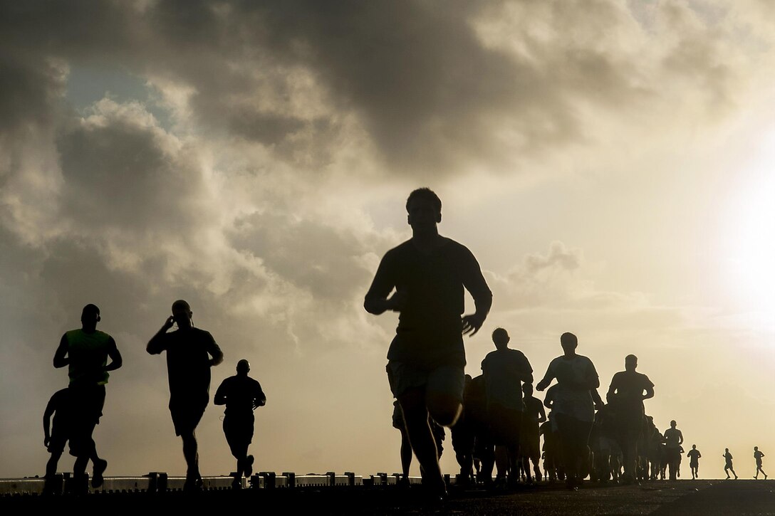 Sailors and Marines run the Sexual Assault Awareness and Prevention Month 5K on the flight deck of the USS Makin Island in the Pacific Ocean, April 21, 2017. The prevention month aims to identify and strengthen the roles that sailors and Marines play in combating sexual assault. Navy photo by Navy Petty Officer 3rd Class Clark Lane