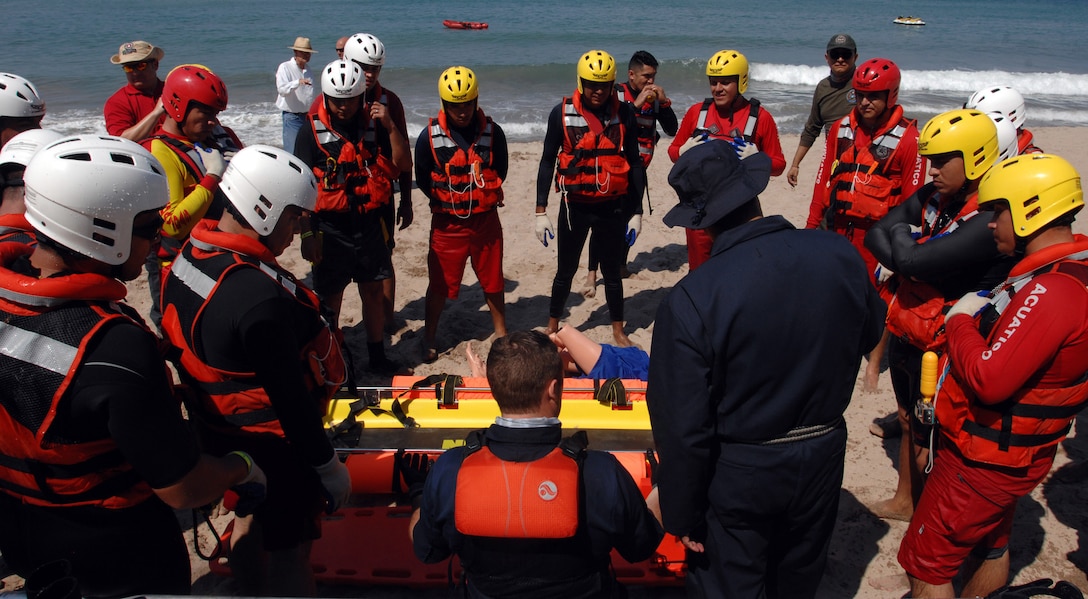 U.S. Public Health Service Cmdr. Kiel Fisher and first responders from the Mexican states of Jalisco and Michoacán review various techniques using a rescue sled to save a water-based victim in Puerto Vallarta, Mexico, March 22, 2017. U.S. Northern Command donated $270,000 of equipment and sent multiple representatives to Puerto Vallarta for a week of water search and rescue training with Mexican firefighters and lifeguards. This training took place in support of Northcom’s humanitarian assistance partnership with the Mexican government. Northcom photo by Air Force 1st Lt. Lauren Hill