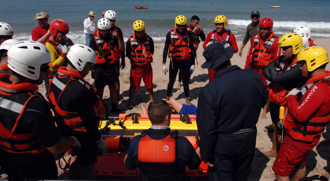 U.S. Public Health Service Cmdr. Kiel Fisher and first responders from the Mexican states of Jalisco and Michoacán review various techniques using a rescue sled to save a water-based victim in Puerto Vallarta, Mexico, March 22, 2017. U.S. Northern Command donated $270,000 of equipment and sent multiple representatives to Puerto Vallarta for a week of water search and rescue training with Mexican firefighters and lifeguards. This training took place in support of Northcom’s humanitarian assistance partnership with the Mexican government. Northcom photo by Air Force 1st Lt. Lauren Hill