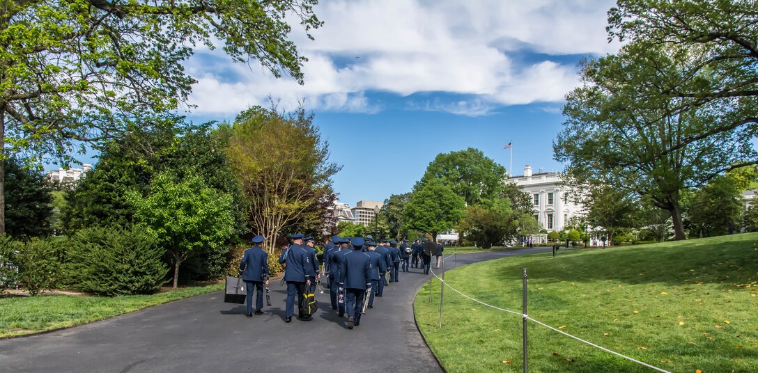 The U.S. Air Force Ceremonial Brass make their way up to the White House to play for the 2017 spring White House Garden Tour. (U.S. Air Force photos/MSgt Brandon Chaney/released)