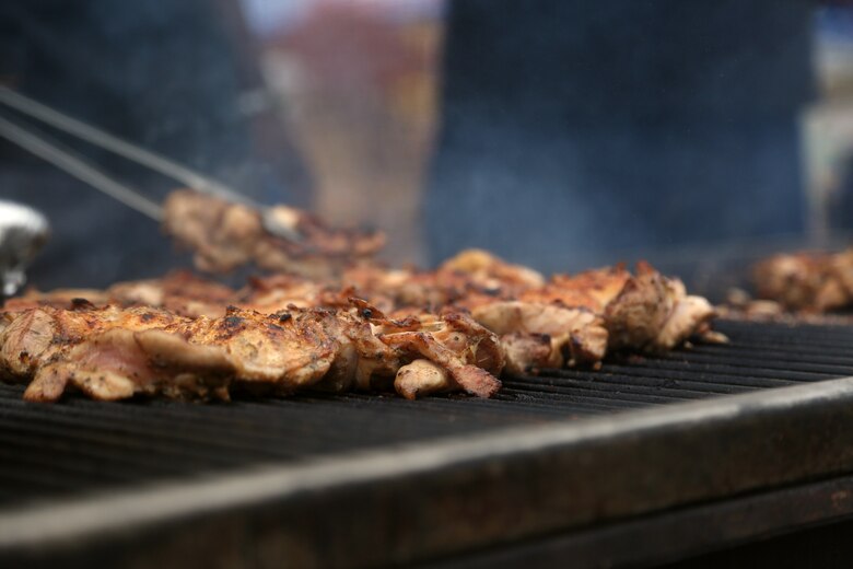 CAMP FOSTER, OKINAWA, Japan – Jamaican jerk chicken cooks on the grill at the 2 Jerks stand during the Camp Foster Festival in Okinawa, Japan. The chicken is part of the menu for 2 Jerks which is run by retired Staff Sgt. Fredrick I. Simpson. Simpson found his love for sharing Jamaican food through the Marine Corps Community Service Festivals. (U.S Marine photo by Lance Corporal Tayler P. Schwamb)