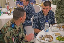 Information Systems Technician Seaman Nicholas Hernandez assigned to guided-missile destroyer USS Truxtun (DDG 103) talks to an Egyptian Navy SEAL during a welcome reception onboard Red Sea Naval Base for Exercise Eagle Salute 17. Eagle Salute/Eagle Response 17 is a multilateral exercise with Egypt, Saudi Arabia and United Arab Emirates to enhance mutual capabilities in maritime security operations. Truxtun is deployed to the U.S. 5th Fleet area of operations in support of maritime security operations designed to reassure allies and partners and preserve the freedom of navigation and the free flow of commerce in the region.