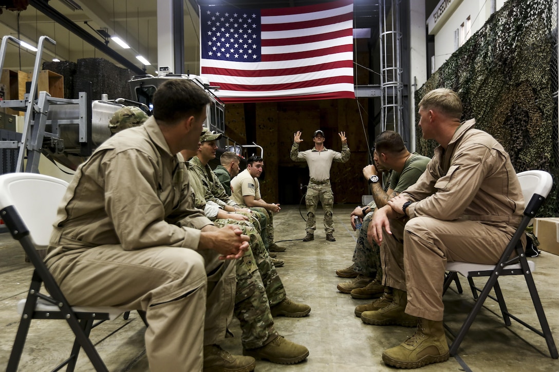 U.S. Special Operations Forces personnel take part in a military freefall jumpmaster course on Kadena Air Base, Okinawa, Japan, April 19, 2017. This marked the first time in history that the course was delivered outside of the continental United States. Hosted by the U.S. Marines Corps 3rd Reconnaissance Battalion and administered by a Mobile Training Team, the course qualified 27 Marines, Soldiers and Airmen as military freefall jumpmasters in Okinawa. (U.S. Marine Corps photo by Lance Cpl. Jordan A. Talley/Released)