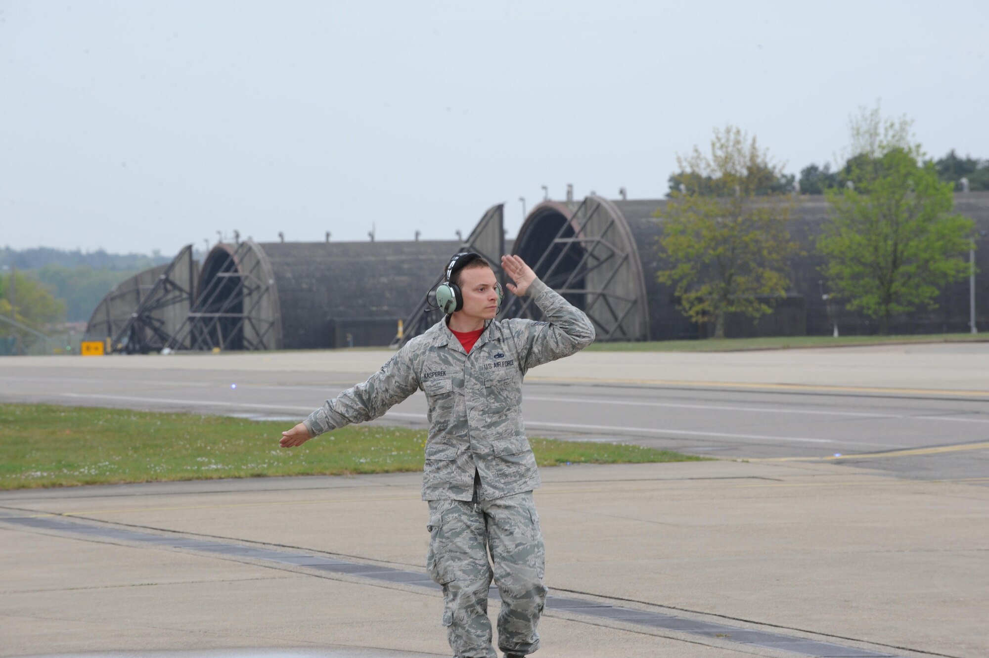 Staff Sgt. Zachary Kasperek, an F-35A crew chief from the 34th Aircraft Maintenance Unit signals to a pilot taxing to the runway at Royal Air Force Lakenheath, United Kingdom. Kasperek as been in the Air Force for 8 and a half years but this is his first deployment and his first time overseas. It’s fitting that he’s supporting the first overseas deployment of the F-35A. Kasperek is from Angola, New York.  (U.S. Air Force photo/Micah Garbarino)