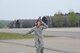 Staff Sgt. Zachary Kasperek, an F-35A crew chief from the 34th Aircraft Maintenance Unit signals to a pilot taxing to the runway at Royal Air Force Lakenheath, United Kingdom. Kasperek as been in the Air Force for 8 and a half years but this is his first deployment and his first time overseas. It’s fitting that he’s supporting the first overseas deployment of the F-35A. Kasperek is from Angola, New York.  (U.S. Air Force photo/Micah Garbarino)