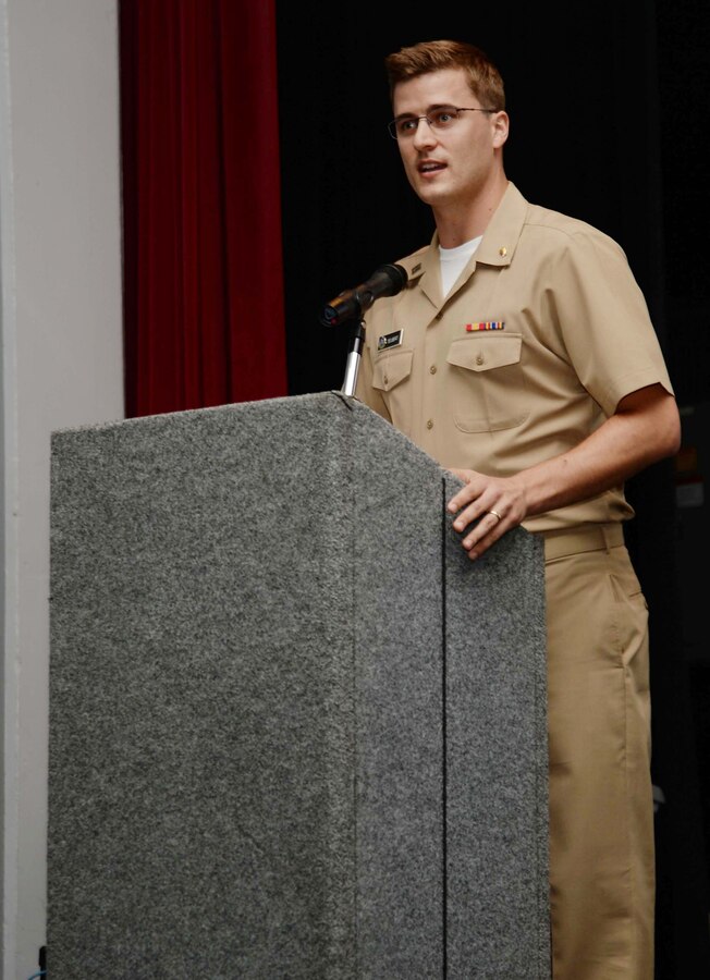 Lt. Chase Seubert, dentist, Dental Clinic, aboard Marine Corps Logistics Base Albany, serves as emcee for Naval Branch Health Clinic-Albany’s African-American heritage celebration, recently. Seubert introduced the line-up of the clinic’s personnel as they entertained attendees at the commemorative program. The event, which began with a feast at NBHC-Albany, ended at the Base Theater, with a private showing of the movie, “Hidden Figures.”