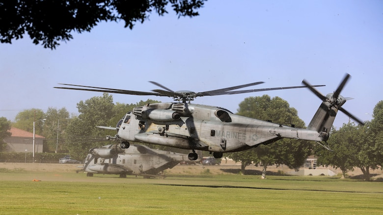 Two CH-53E Super Stallions with  Marine Aviation Weapons and Tactics Squadron 1 land in Kiwanis Park, Ariz., during the Assault Support Tactics 3 training while supporting the semiannual Weapons and Tactics Instructor Course 2-17, April 21. Lasting seven weeks, WTI is a training evolution hosted by MAWTS-1 which provides standardized advanced and tactical training and certification of unit instructor qualifications to support Marine aviation training and readiness. The AST-3 training focused on conducting noncombatant evacuation operations in an urban environment while providing foreign humanitarian assistance to the simulated host nation.