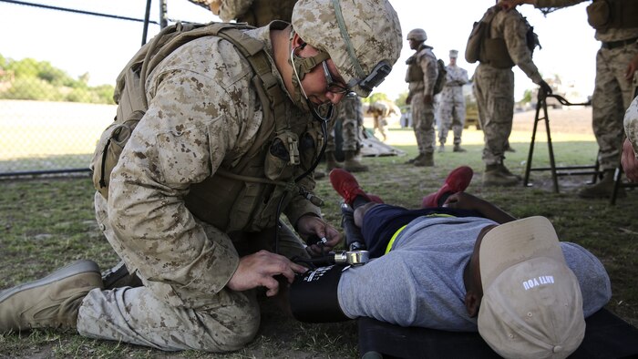 A role player seeks medical attention during Assault Support Tactics 3, supporting Marine Aviation Weapons and Tactics Squadron during the semiannual Weapons and Tactics Instructor Course 2-17 at Marine Corps Air Station Yuma, Arizona, April 21. Lasting seven weeks, WTI is a training evolution hosted by MAWTS-1 which provides standardized advanced and tactical training and certification of unit instructor qualifications to support Marine aviation training and readiness. The AST-3 training focused on conducting noncombatant evacuation operations in an urban environment while providing foreign humanitarian assistance to the simulated host nation.
