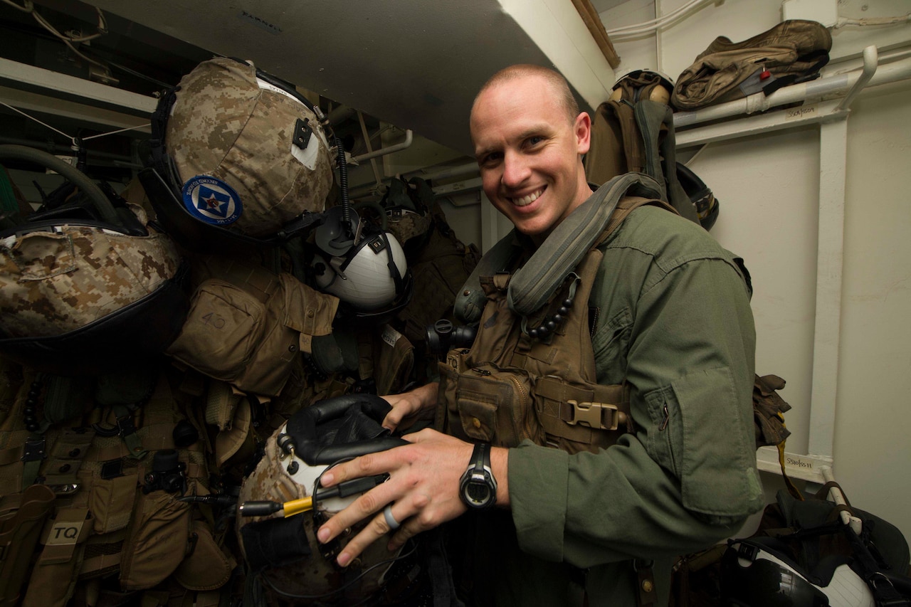 Marine Corps Capt. Benjamin Hovies, a CH-53 Super Stallion helicopter pilot assigned to Marine Medium Tiltrotor Squadron 365 (Reinforced), poses for a photo aboard the amphibious assault ship USS Bataan while at sea in the Atlantic Ocean, March 13, 2017. The ship is deployed with the Bataan Amphibious Ready Group in support of maritime security operations and theater security cooperation efforts in the U.S. 6th Fleet area of responsibility. Navy photo by Petty Officer 2nd Class Magen F. Reed