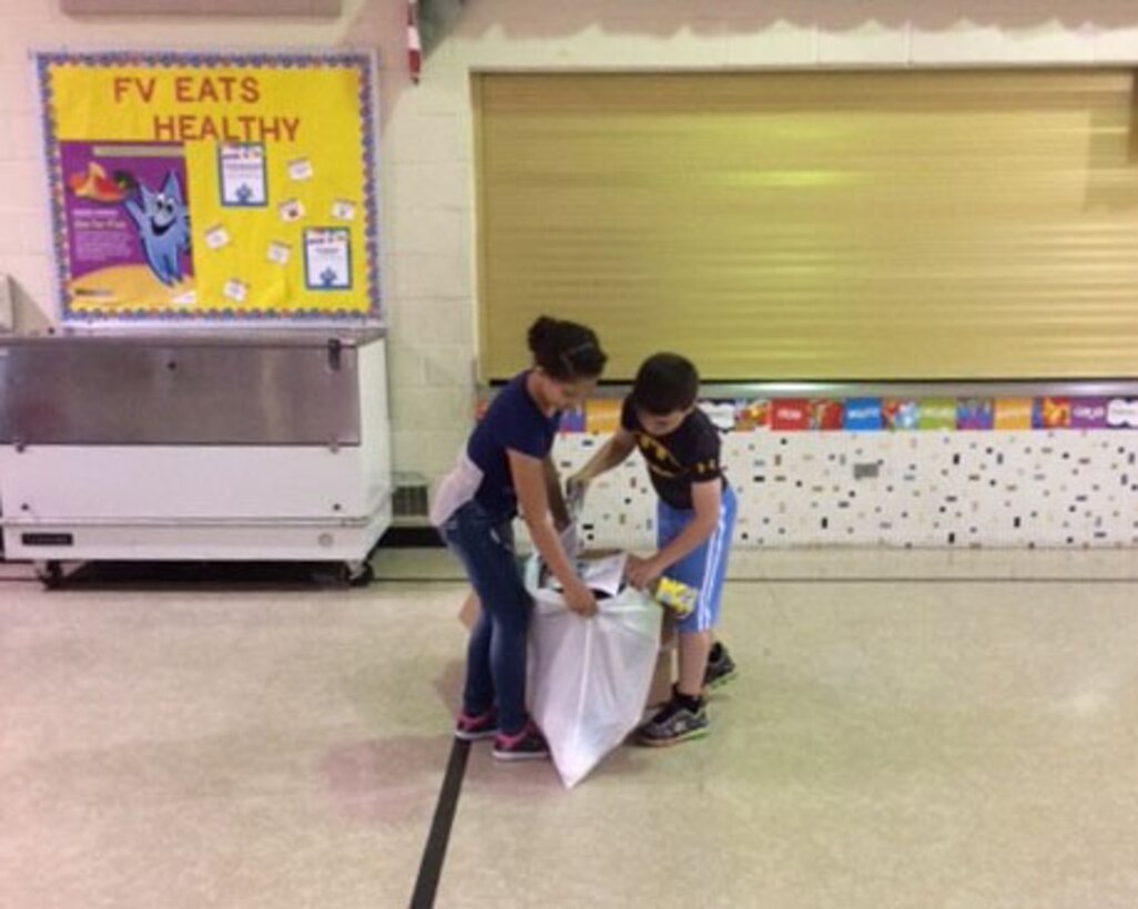 Students participate in a recycling race.