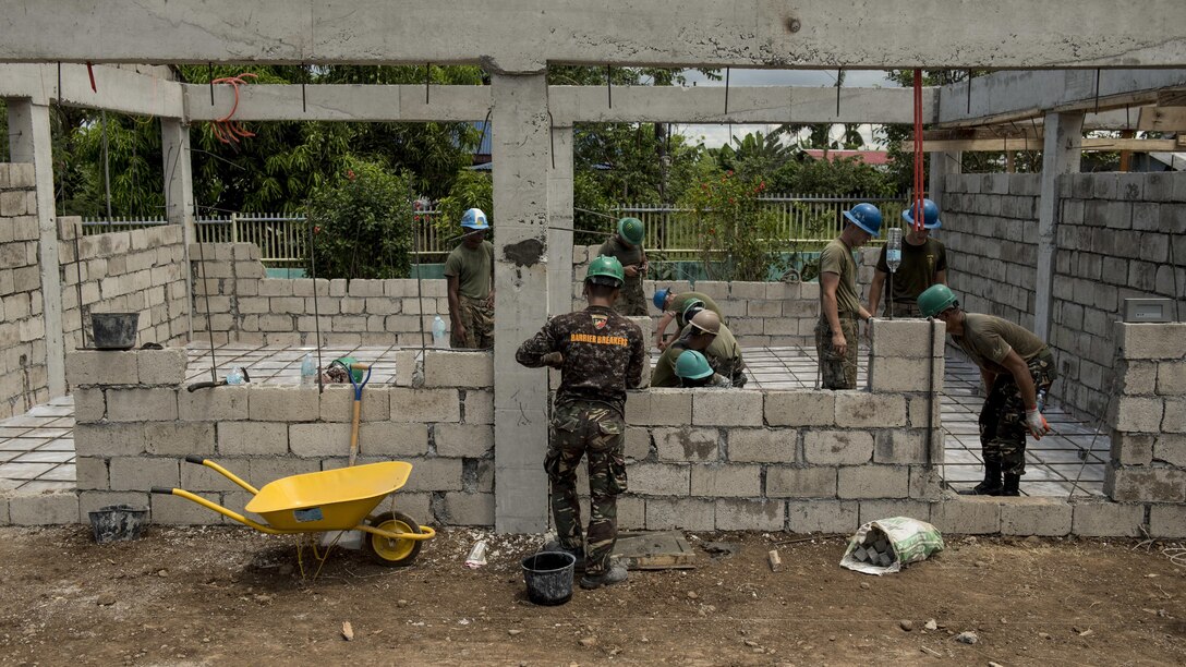 Philippine soldiers and U.S. military engineers prepare a structure for concrete pouring during Balikatan 2017 in Ormoc, Leyte, April 23, 2017. Armed Forces of the Philippines and U.S. military engineers worked together to build a new classroom at Don Carlos Elementary School in Ormoc. Balikatan is an annual U.S.-Philippine military bilateral exercise focused on a variety of missions, including humanitarian assistance and disaster relief and counterterrorism.