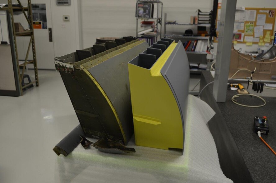 The Air Force Research Laboratory’s Advanced Power Technology Office is testing a new, lightweight composite RAM Air Inlet system (right) for the C-5M Super Galaxy Transport Aircraft. The new part is intended to replace legacy air inlets, mitigating corrosion issues while providing a lightweight, cost-effective solution to help maintain the fleet. (U.S. Air Force courtesy photo)