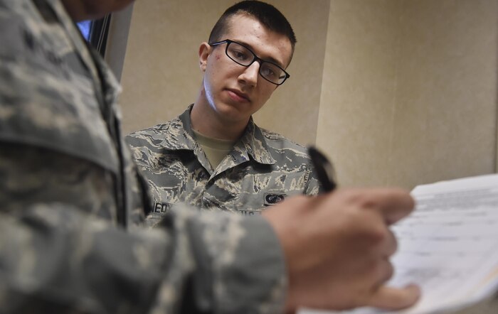 Airman 1st Class Matthew Kennedy, 628th Contracting Squadron contract specialist, pushes paperwork through an approval process during a contingency contracting exercise at Joint Base Charleston, S.C., April 21, 2017. The 628th CONS and 628th Comptroller Squadron integrated to increase readiness during the exercise and tested the skillsets and knowledge of junior contracting and finance Airmen helping prepare them for a deployed environment.
