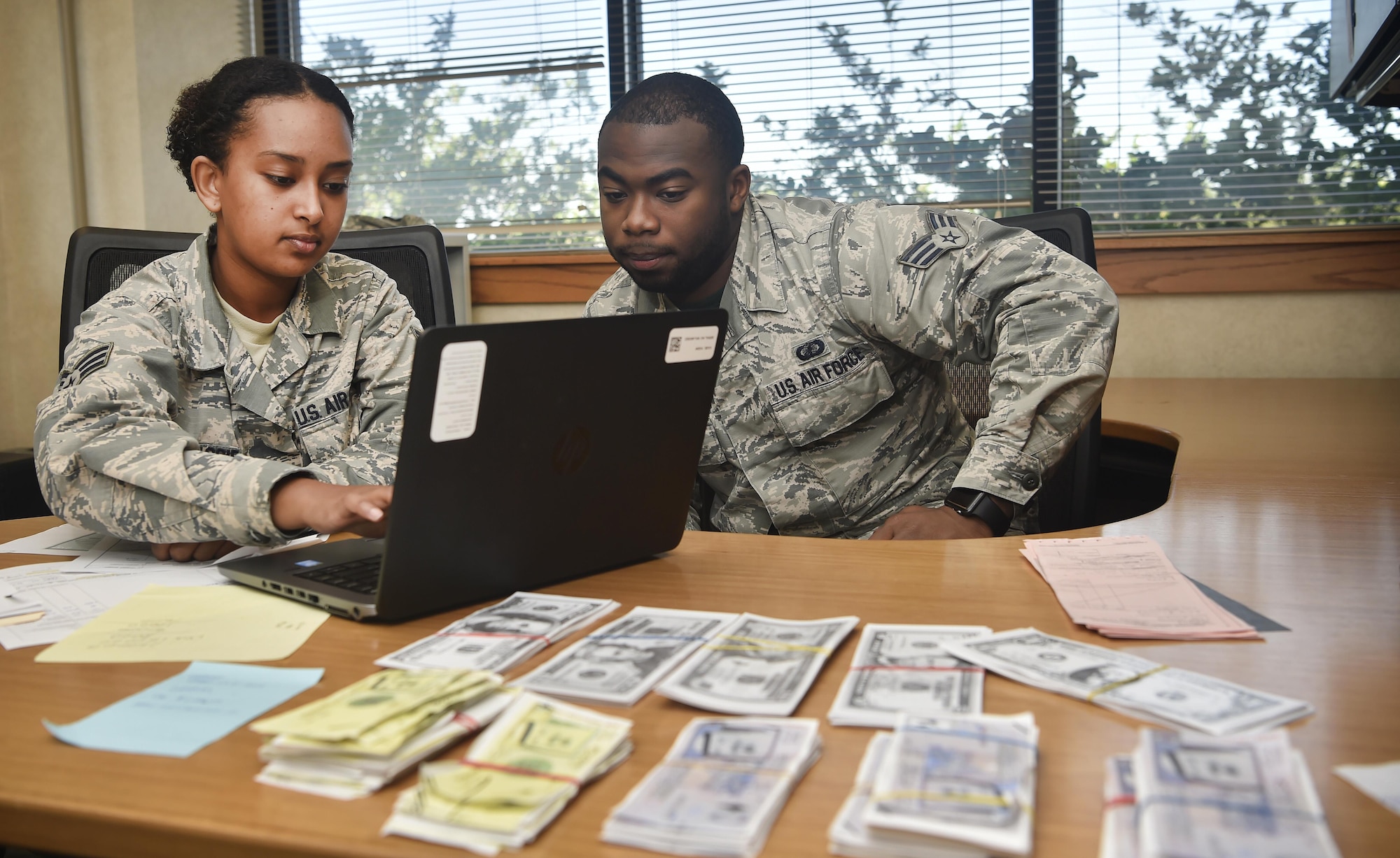 Senior Airman Menebere Haileselassie, left, 628th Comptroller Squadron travel technician, and Senior Airman Xavier Miles, right, 628th CPTS military pay technician, participate in a contingency contracting exercise at Joint Base Charleston, S.C., April 21, 2017. The 628th Contracting Squadron and 628th CPTS trained side-by-side during the exercise to test skillsets and knowledge of junior contracting and finance Airmen helping prepare them for a deployed environment.