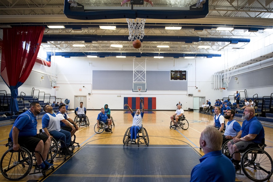 Sandra Marrero, a Warrior CARE athlete, takes her foul shot during the wheelchair basketball session of the adaptive sports camp at Eglin Air Force Base, Fla., April 25. The base hosts the week-long Wound Warrior CARE event that helps recovering wounded, ill and injured military members through specific hand-on rehabilitative training. (U.S. Air Force photo/Samuel King Jr.)