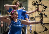 Ashley Crites and Melinda Smith, Warrior Games athletes, take aim at the bullseye during an archery session at the Air Force team’s training camp at Eglin Air Force Base, Fla., April 25. The base-hosted, week-long Warrior Games training camp is the last team practice session before the yearly competition in June. (U.S. Air Force photo/Samuel King Jr.)