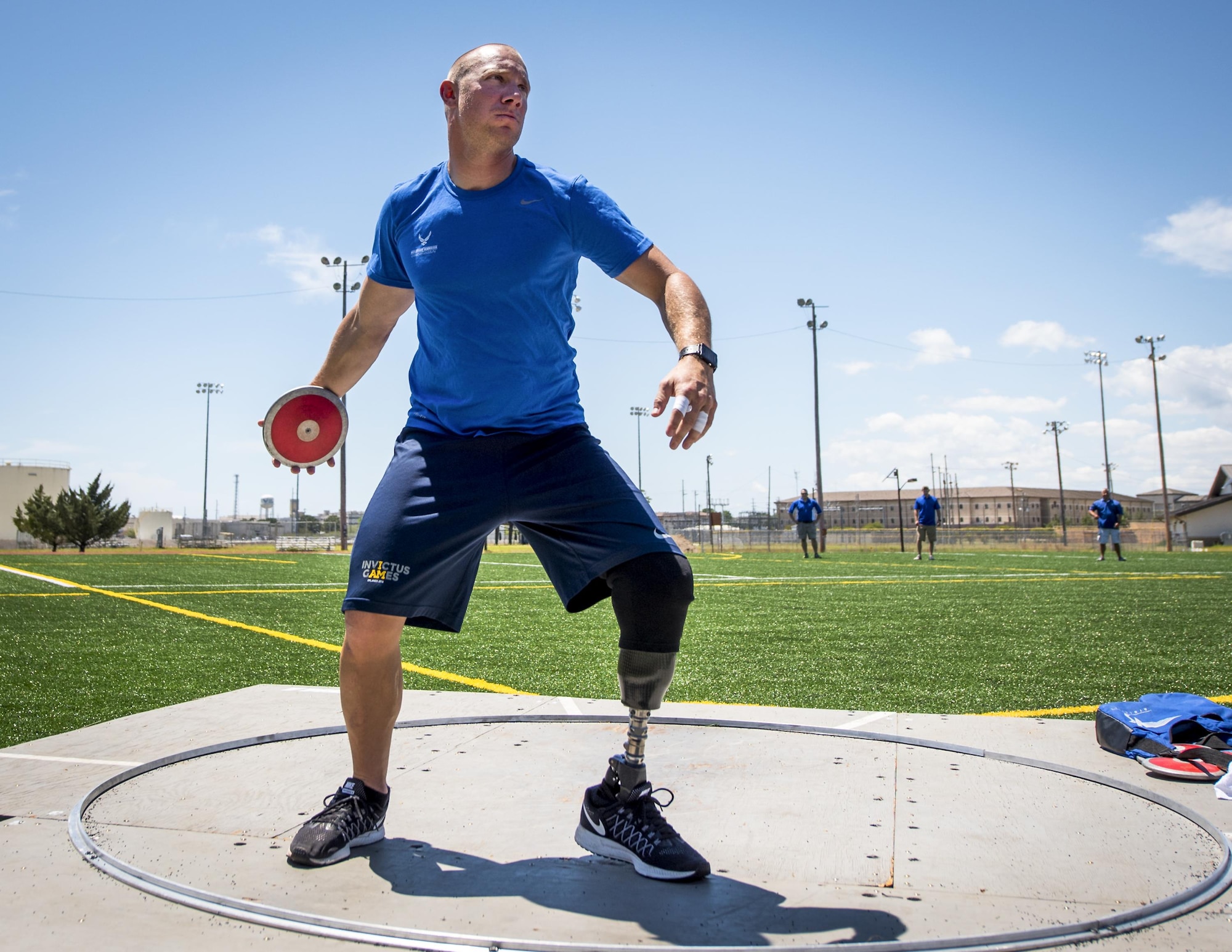 Ben Seekell, a Warrior Games athlete, begins his discus rotation during a track and field session at the Air Force team’s training camp at Eglin Air Force Base, Fla., April 25. The base-hosted, week-long Warrior Games training camp is the last team practice session before the yearly competition in June. (U.S. Air Force photo/Samuel King Jr.)