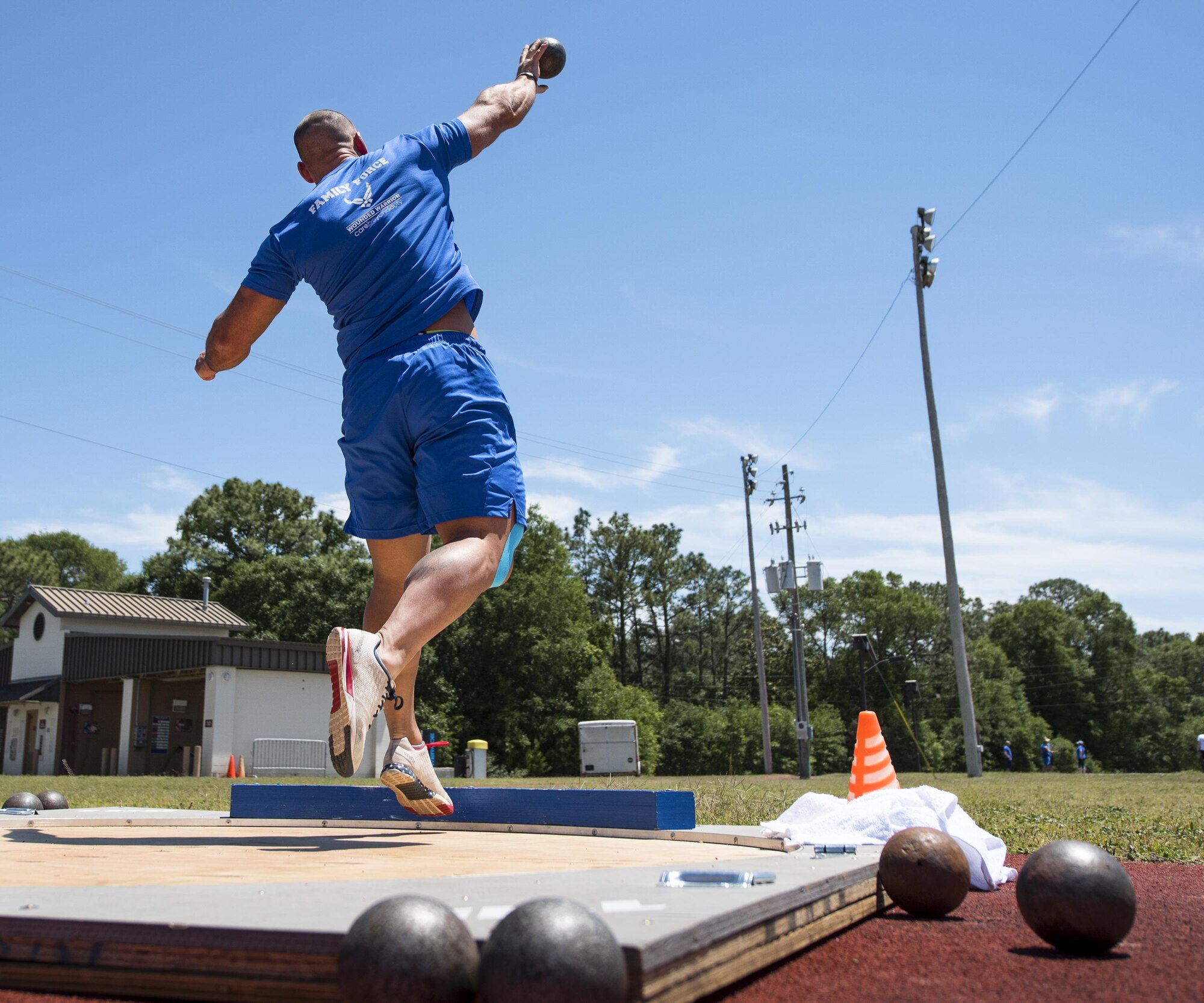 Matt Cable, a Warrior Games athlete, releases his shot during a track and field session at the Air Force team’s training camp at Eglin Air Force Base, Fla., April 25. The base-hosted, week-long Warrior Games training camp is the last team practice session before the yearly competition in June. (U.S. Air Force photo/Samuel King Jr.)