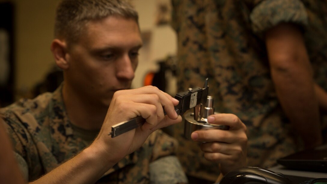 Sgt. Chris P. Tellef, a fire team leader with the Logistics Combat Element, Special Purpose Marine Air-Ground Task Force - Southern Command, measures a water jet nozzle during the 3-D Printing Training Course at Marine Corps Base Camp Lejeune, North Carolina, April 20, 2017. Marines from various sections of SPMAGTF-SC attended the two-day training hosted by General Support Maintenance Company, 2nd Maintenance Battalion, Combat Logistics Regiment 25, 2nd Marine Logistics Group, in order to gain hands-on experience with 3-D printers and receive instruction in computer-aided design, file creation and manufacturing.