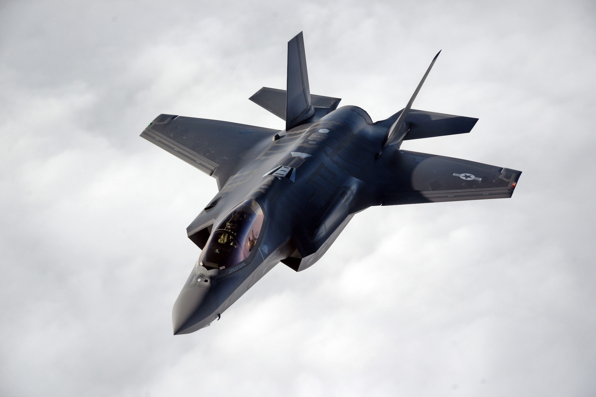 A U.S. Air Force F-35 Lightning II from Hill Air Force Base, Utah, flys alongside a 100th Air Refueling Wing KC-135 Stratotanker in formation during a flight to RAF Lakenheath April 25, 2017. The F-35’s are participating in their first-ever flying training deployment to Europe. (U.S. Air Force photo by Senior Airman Christine Groening) 
