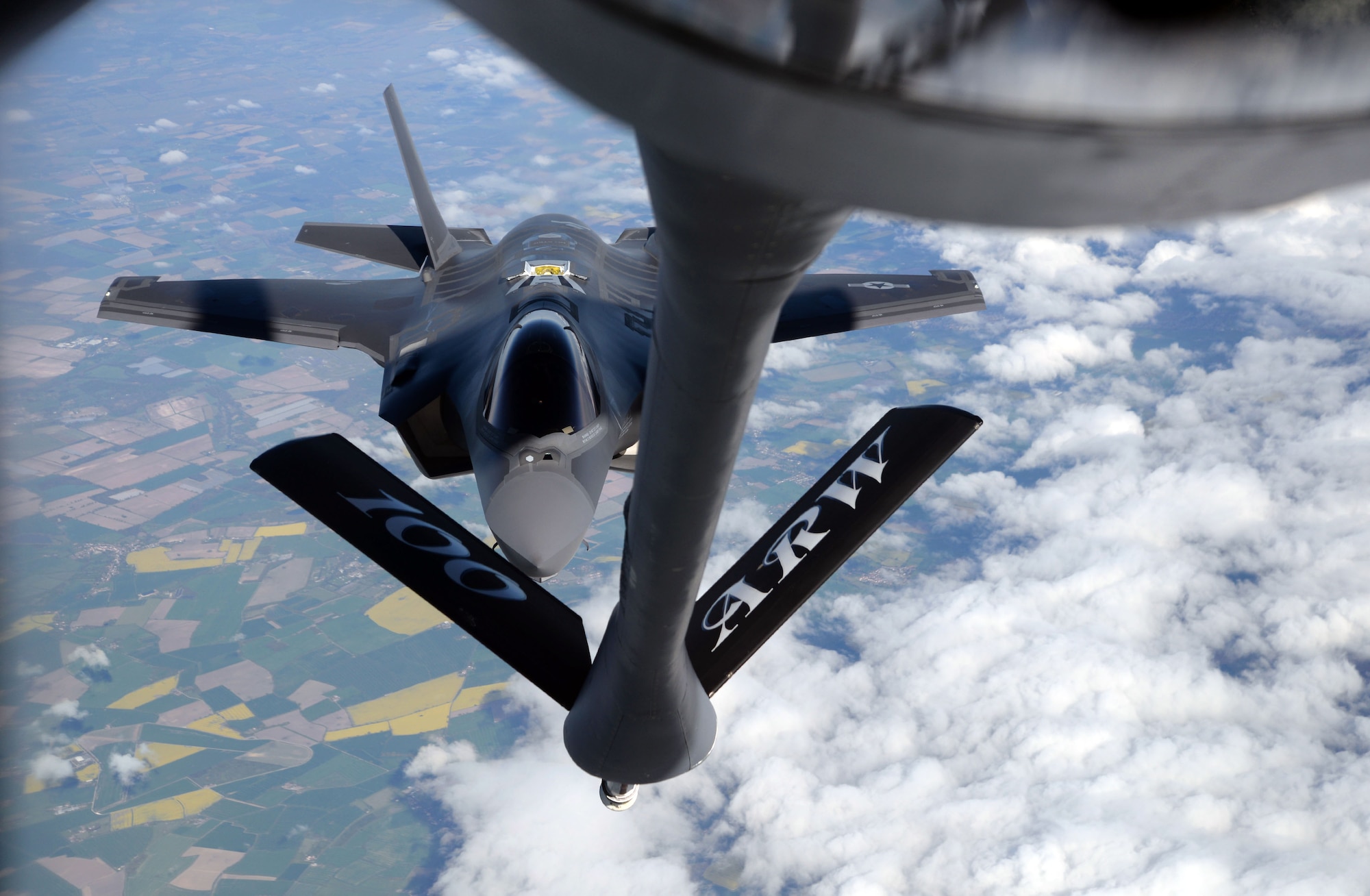 A U.S. Air Force F-35A Lightning II aircraft assigned to Hill Air Force Base, Utah, is refueled by a 100th Air Refueling Wing KC-135 Stratotanker during a flight to Estonia, April 25, 2017. The F-35s participated in a first-ever flying training deployment to Europe, and the forward deployment to Estonia allowed Airmen to better understand NATO's current infrastructure and strengthen interoperability with allies. (U.S. Air Force photo by Senior Airman Christine Groening) 
