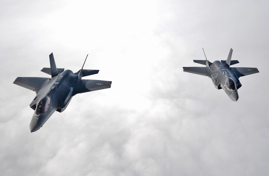 U.S. Air Force F-35 Lightning II's from Hill Air Force Base, Utah, flys alongside a 100th Air Refueling Wing KC-135 Stratotanker in formation during a flight to RAF Lakenheath April 25, 2017. The F-35’s are participating in their first-ever flying training deployment to Europe. (U.S. Air Force photo by Senior Airman Christine Groening) 
