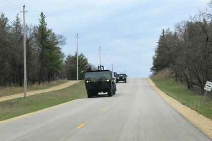 Soldiers at Fort McCoy for the Operation Cold Steel exercise drive military vehicles along a range road near Range 34 on April 18, 2017, on North Post. Operation Cold Steel is the Army Reserve’s first large-scale live-fire training and crew-served weapons qualification and validation exercise that took place from March 9 through April 25. According to the Reserve, the exercise is crucial to ensure ensure that America’s Army Reserve units and Soldiers are trained and ready to deploy on short notice and bring combat-ready and lethal firepower in support of the Total Army Force and Joint Force partners around the world. (U.S. Army Photo by Scott T. Sturkol, Public Affairs Office, Fort McCoy, Wis.)
