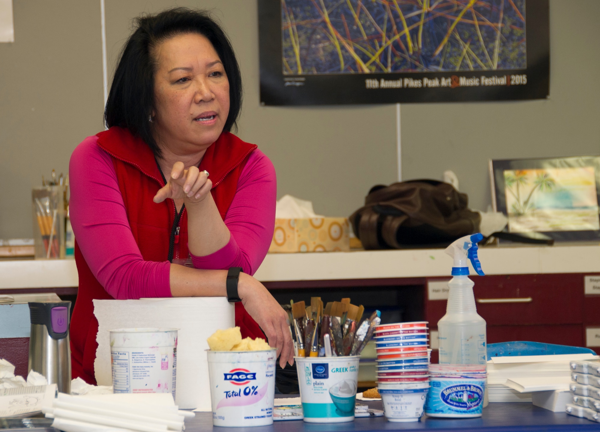 SCHRIEVER AIR FORCE BASE, Colo. -- Kim le Nguyen explains her artistic process to members of the 310th Operations Support Squadron during a course at the Bemis School of Art in Colorado Springs on Friday, Apr. 21st, 2017. Nguyen teaches a Military Artistic Healing program at the Colorado Springs Fine Arts Center, using all forms of art to encourage healing among military members and their families.  (U.S. Air Force photo/Senior Airman Laura Turner)