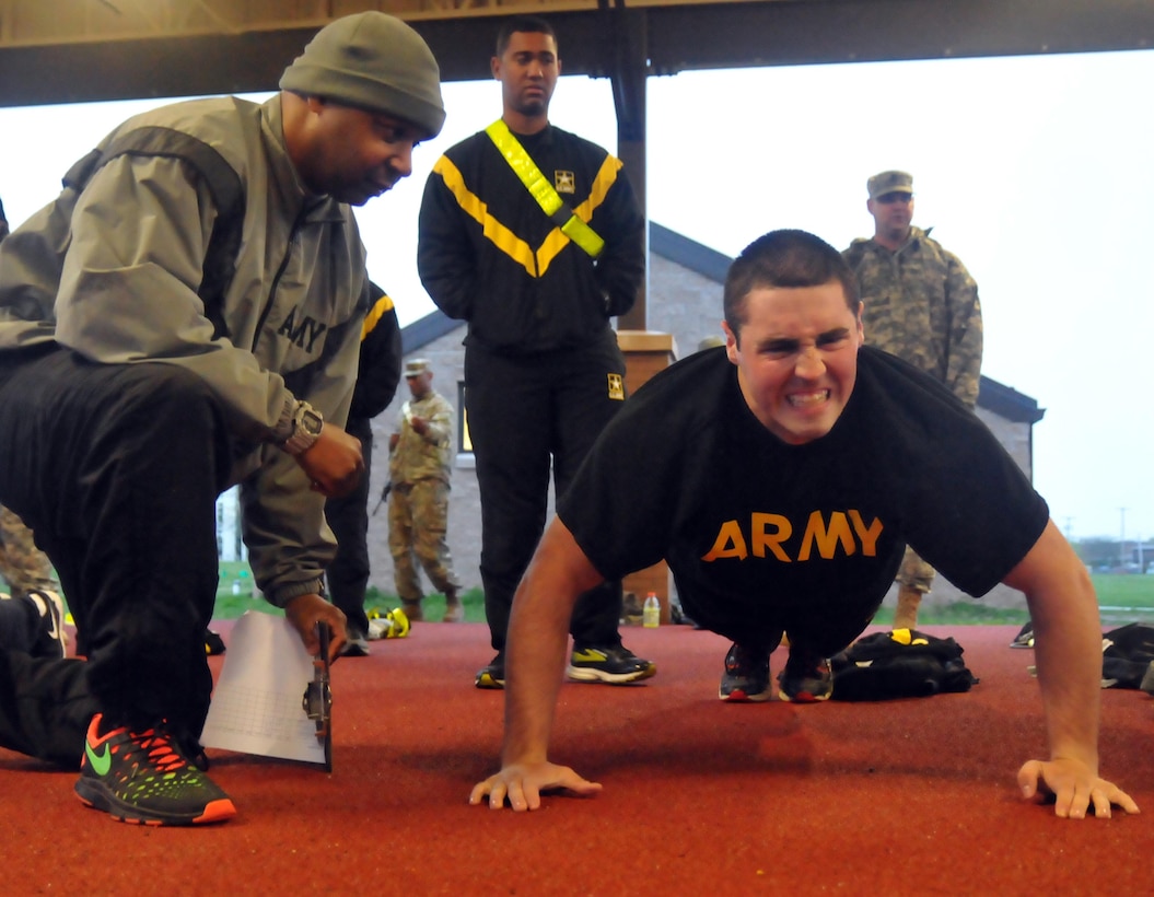 U.S. Army Reserve Pfc. Nicholas Smith, 316th Mobility Augmentation Company, 844th Engineer Battalion , 926th Engineer Brigade, based in Chattanooga, Tenn., grimaces as he knocks out push ups during the Combined Best Warrior Competition Army Physical Fitness Test on Joint Base McGuire-Dix-Lakehurst. N.J., April 25, 2017. Contestants  hopefully take the title of Best Noncommissioned Officer or Best Soldier and move on to represent the 412th Theater Engineer Command,  416th Theater Engineer Command and 76th Operational Response at the USARC Best Warrior Competition. (U.S. Army Reserve Photo by Sgt. 1st Class Clinton Wood).