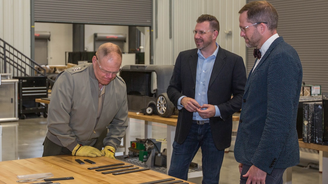 Commandant of the Marine Corps Gen. Robert B. Neller tries to break a piece of 3D printed plastic at the Local Motors Microfactory, Knoxville, Tennessee, April 25, 2017. Neller visited to better understand innovative co-creation and manufacturing. 