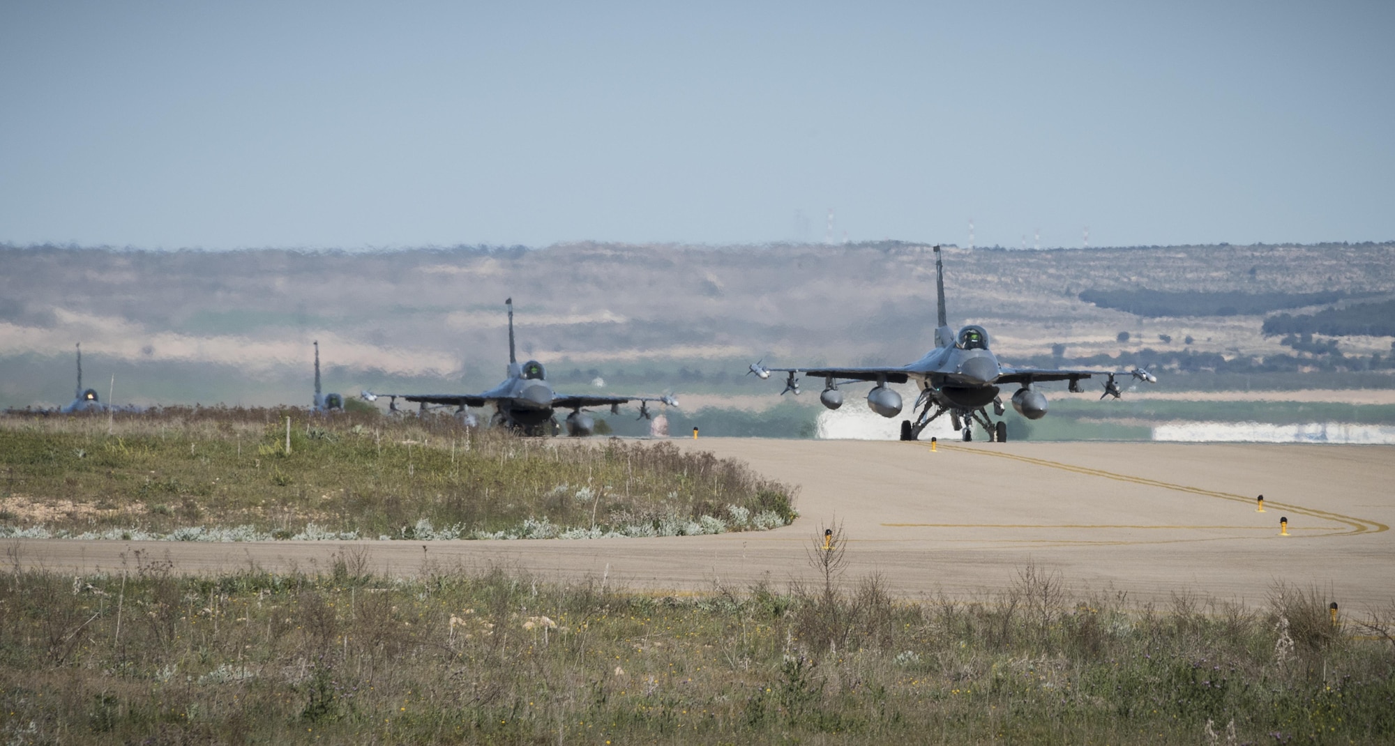 F-16 Fighting Falcons from Hill Air Force Base, Utah, taxi down the runway April 21, 2017, at Albacete Air Base, Spain, to participate in the Tactical Leadership Programme. TLP is an annual NATO Mission Commander’s School training program designed to provide joint tactical training with NATO allies to increase NATO coordination and strengthen combined air operations. This type of training is an opportunity for Hill’s active duty and Reserve Airmen to hone their operational and tactical leadership skills with allied air forces. (U.S. Air Force photo/Senior Airman Justin Fuchs)