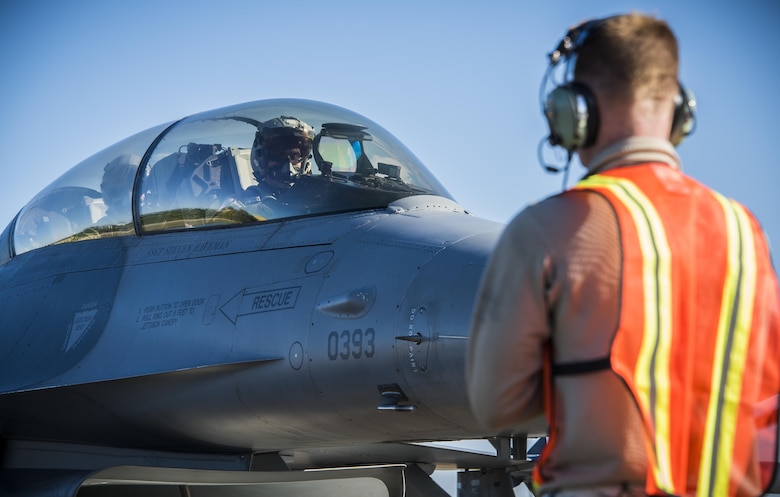 Airman 1st Class Drew Snider, a crew chief from the 388th Maintenance Squadron at Hill Air Force Base, Utah, guides Capt. Jeff “Strobe” Whitford, a pilot from the 421st Fighter Squadron, to park his F-16 Fighting Falcon April 21, 2017, on Albacete Air Base, Spain. This is the first time the 419th and 388th Fighter Wings from Hill Air Force Base, Utah, are participating in the Tactical Leadership Program. TLP is an annual NATO Mission Commander’s School training program designed to provide joint training to increase NATO coordination and ensure stability in the region. (U.S. Air Force photo/Senior Airman Justin Fuchs)