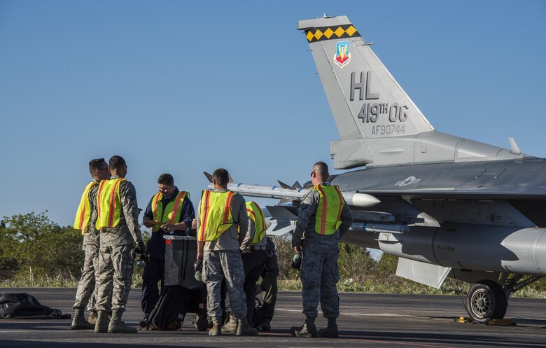 U.S. Airmen from Hill Air Force Base, Utah, prepare to “put a jet to bed” April 21, 2017, at Albacete Air Base, Spain, after flying more than seven hours from the U.S. to participate in the Tactical Leadership Programme. Training courses like TLP help to enable the NATO alliance by providing an opportunity to work alongside NATO allies in the classroom and in European airspace. (U.S. Air Force photo/Senior Airman Justin Fuchs)