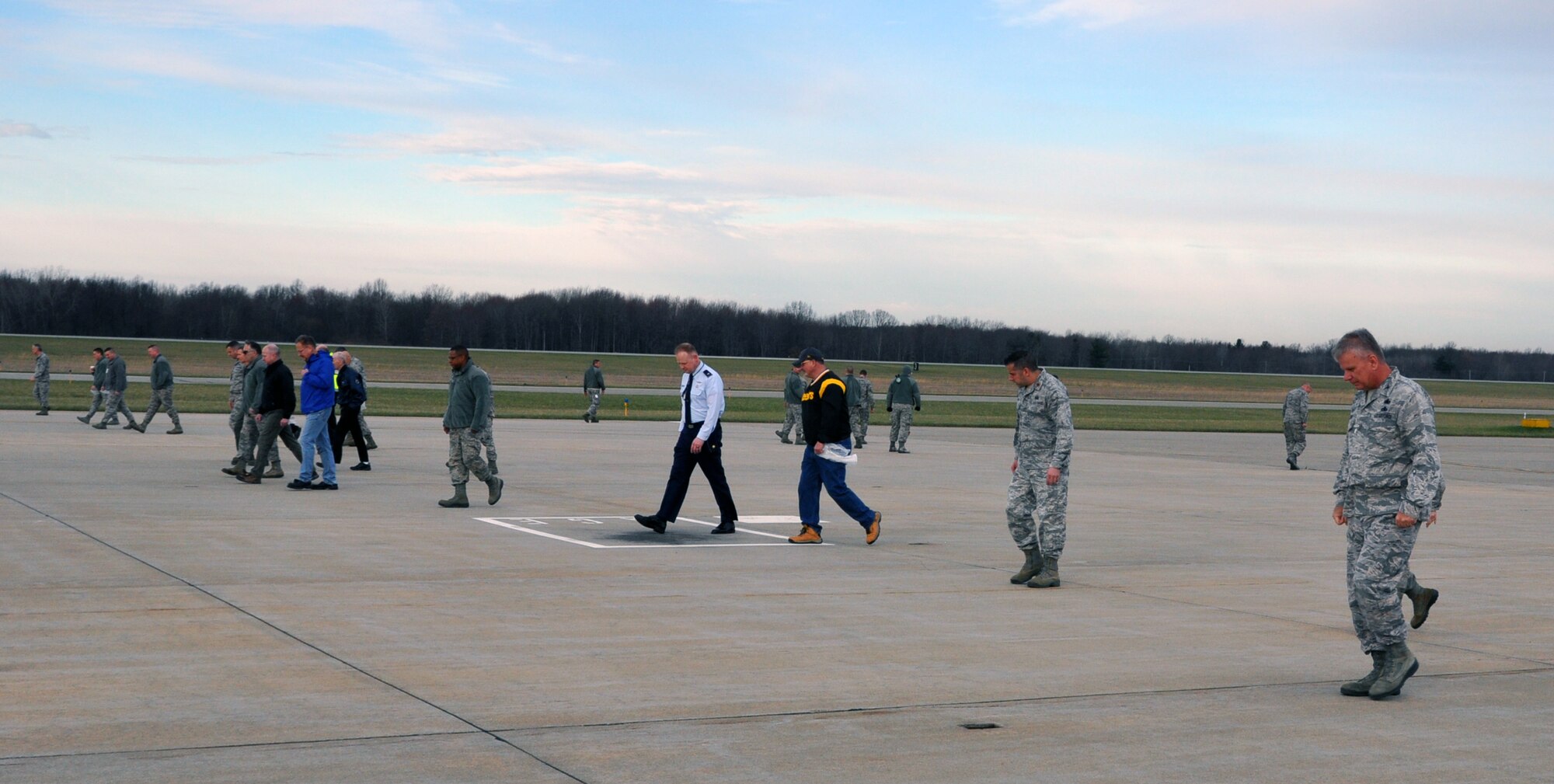 Personnel from across Youngstown Air Reserve Station participate in a Foreign Object Debris (FOD) walk on the flightline here, April 3, 2017. FOD walks are routinely held to clear the flightline of any objects alien to the area that could potentially cause damage to aircraft. Examples of FOD include broken pavement, wire bristles from snow removal equipment, trash and parts from ground vehicles. (U.S. Air Force photo/Maj. Polly Orcutt)