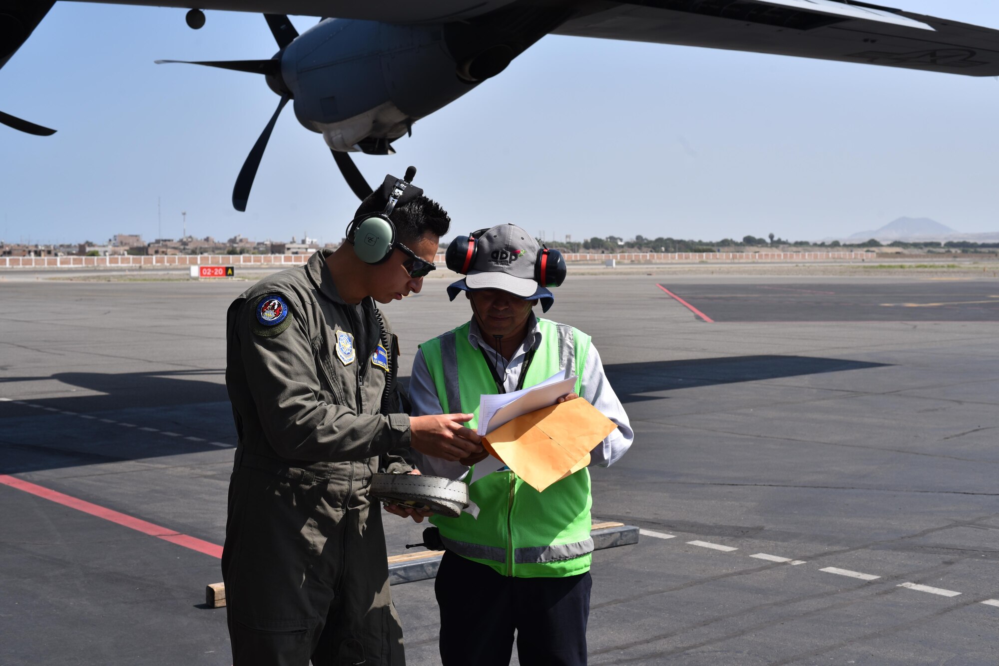 U.S. Air Force Airman 1st Class Miguel Pinzon, 19th Security Forces Squadron phoenix raven member, reviews the flight manifest April 16, 2017, in Lima, Peru. (U.S. Air Force photo by Staff Sgt. Jael Laborn)