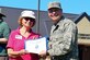 U.S. Air Force Col. David Stanfield, 633rd Mission Support Group commander, presents a Certificate of Appreciation to Barbare Krumpon, Virginia Cooperative Extension volunteer, during an Arbor Day event at Joint Base Langley-Eustis, Va., April 21, 2017. Krumpon and two other volunteers surveyed every tree on Langley Air Force Base for three consecutive years and discovered there were more than 70 different tree species on the installation. (U.S. Air Force photo/Senior Airman Derek Seifert)