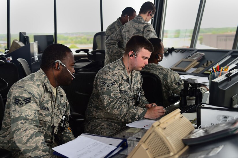 Members of the 1st Operations Support Squadron air traffic control tower conduct normal operations during ATLANTIC TRIDENT 17 at Joint Base Langley-Eustis, Va., April 19, 2017. The ATC members received simulated training before the exercise began, ensuring they would be prepared for the additional aircraft on the flightline. (U.S. Air Force photo/ Senior Airman Kimberly Nagle)