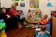 Kathryn Barrager, Child Development Center family child care provider, reads to the children at Joint Base Langley-Eustis, Va., Feb. 28, 2017. Barrager was awarded the 2016 Provider of the Year for Fort Eustis. (U.S. Air Force photo/Senior Airman Derek Seifert)