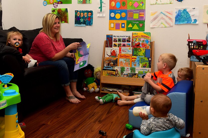 Kathryn Barrager, Child Development Center family child care provider, reads to the children at Joint Base Langley-Eustis, Va., Feb. 28, 2017. Barrager was awarded the 2016 Provider of the Year for Fort Eustis. (U.S. Air Force photo/Senior Airman Derek Seifert)