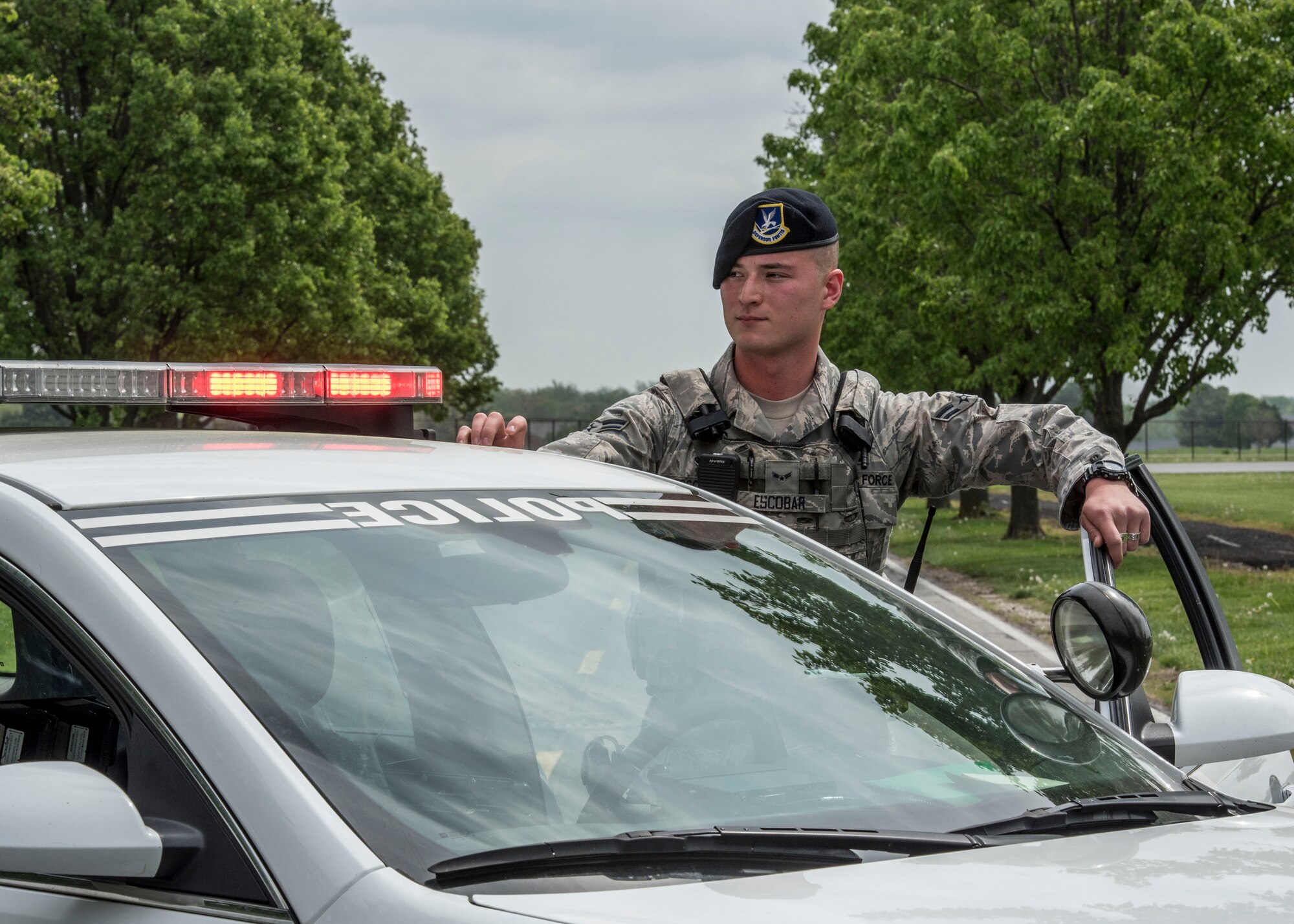 Airman 1st Class Rodolfo Escobar, 375th Security Forces Squadron, controls an entry control point during an exercise, Scott Air Force Base, Ill., April 20, 2017. The exercise prepared Scott Air Force Base personnel for air show incident response.  First responders managed over 70 patients and practiced their procedures in the event of an aircraft accident.   (U.S. Air Force photo by Staff Sgt. Jodi Martinez)