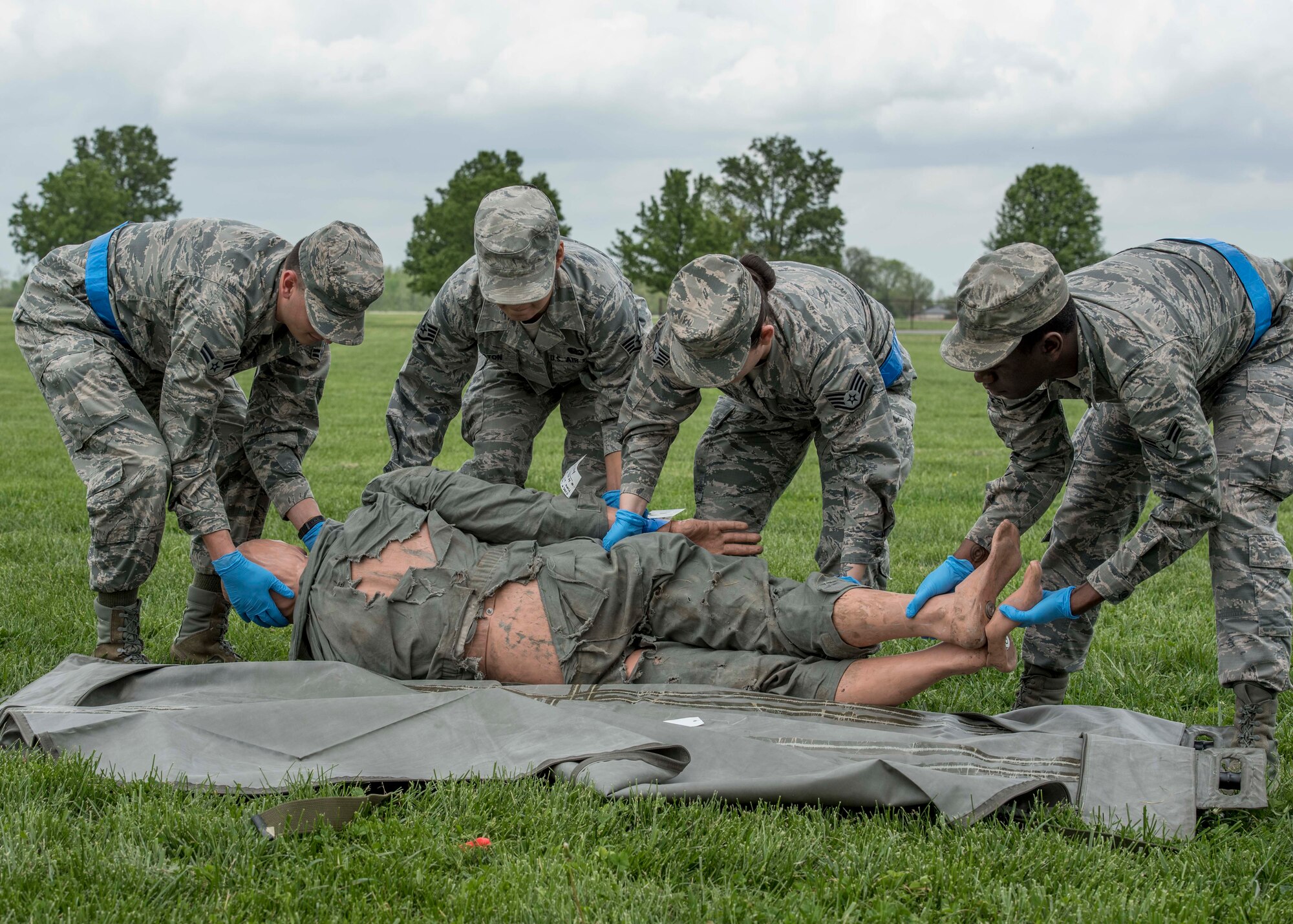 Mortuary affairs Airmen of the 375th Force Support Squadron conduct their procedures of collecting bodies during an exercise that tested Scott personnel on their emergency reactions to an air show, Scott Air Force Base, Ill., April 20, 2017.  The exercise prepared Scott Air Force Base personnel for air show incident response.  First responders managed over 70 patients and practiced their procedures in the event of an aircraft accident.